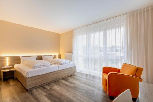 Ένα ή περισσότερα κρεβάτια σε δωμάτιο στο Hotel Goll