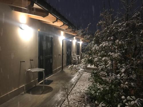 a row of lights on a building at night at B&B Oasi Vetoio in LʼAquila
