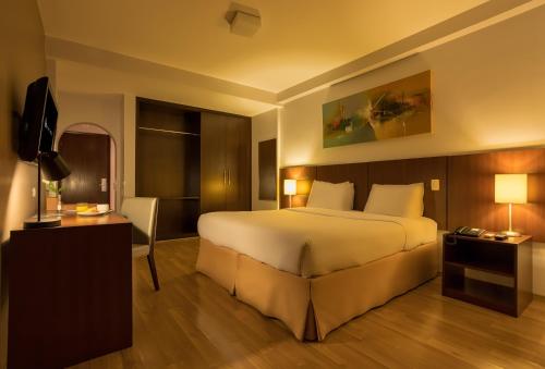 Postel nebo postele na pokoji v ubytování H3 Hotel Paulista