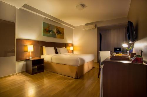 Postel nebo postele na pokoji v ubytování H3 Hotel Paulista