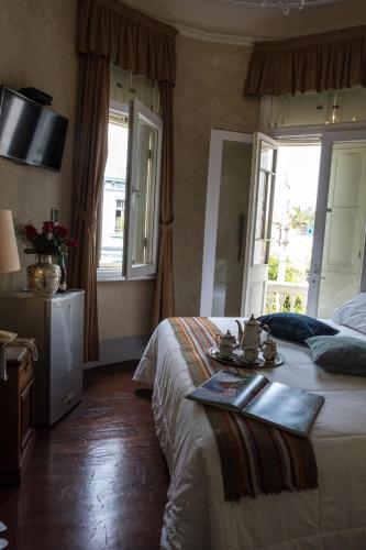 a hotel room with a bed and a window at Casa Falleri Boutique Hotel in Lima