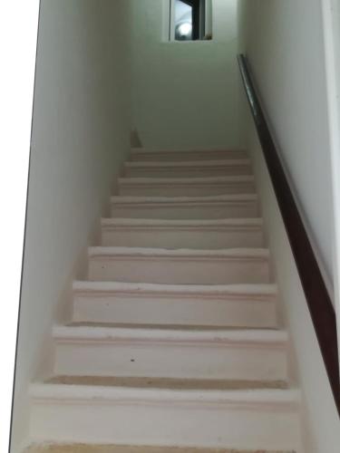 a staircase in a house with white walls at Casa Filomena in Ostuni