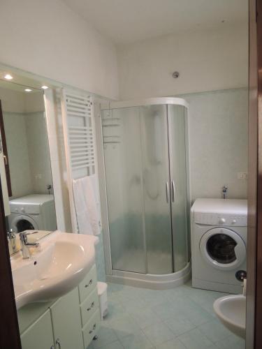 a bathroom with a shower and a washing machine at "Al Castello" Biennale - Venezia in Venice