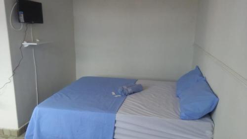 Katil atau katil-katil dalam bilik di Casa do Meio Pousada