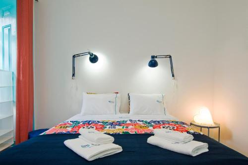 Katil atau katil-katil dalam bilik di C&O Guest House Alcântara-Lisbon