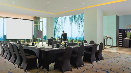 a conference room with a long table and chairs at InterContinental Bandung Dago Pakar by IHG in Bandung