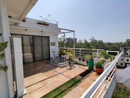 a balcony of a house with plants on it at Garden Homes 1& 6 in Kolhapur