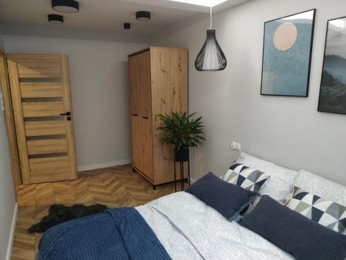 Posteľ alebo postele v izbe v ubytovaní Apartament Skrytka