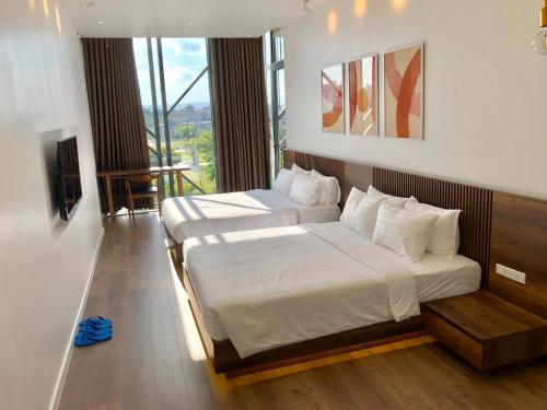 Giường trong phòng chung tại Coconut Hotel Phú Yên