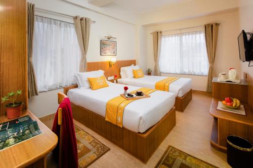 Postel nebo postele na pokoji v ubytování Pema Boutique Hotel