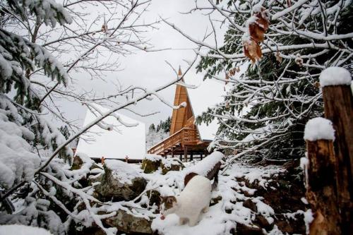 a steeple of a church covered in snow at Kedra Village in Kédra