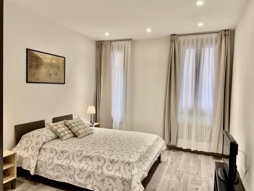 a bedroom with a bed and a television in it at Corte Contarina in Venice