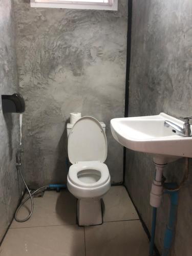 a bathroom with a toilet and a sink at BP Room 2 budget in Ko Mak