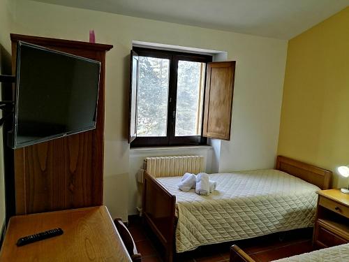 Letto o letti in una camera di Casa per Ferie Ulivo d'Assisi