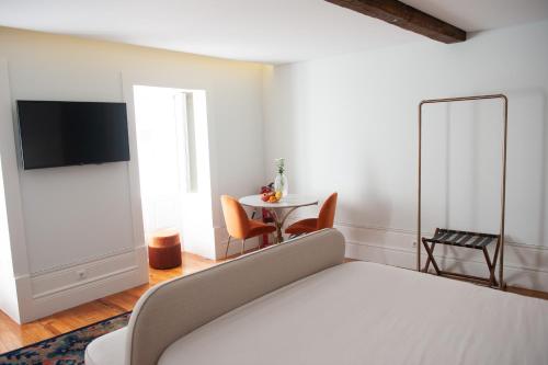 Una cama o camas en una habitación de GuimaraesIN