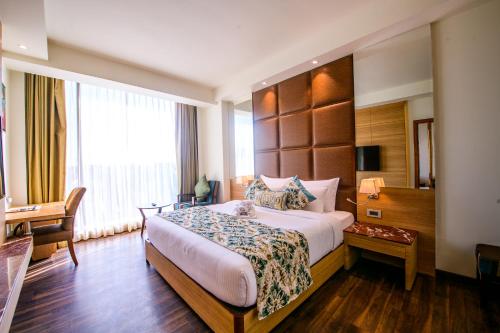 Ένα ή περισσότερα κρεβάτια σε δωμάτιο στο Best Western La Vista Pathankot