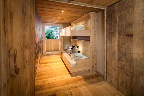a small room with a cow sitting inside of it at Hundehotel Riederhof in Ried im Oberinntal