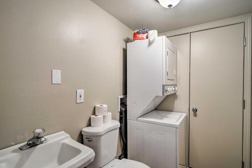 a bathroom with a white toilet and a sink at Cozy Condo Steps to Lake Michigan, 5 Mi to Boyne! in Harbor Springs