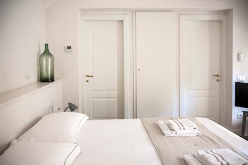 Ένα ή περισσότερα κρεβάτια σε δωμάτιο στο Pietrapiana Boutique Apartments