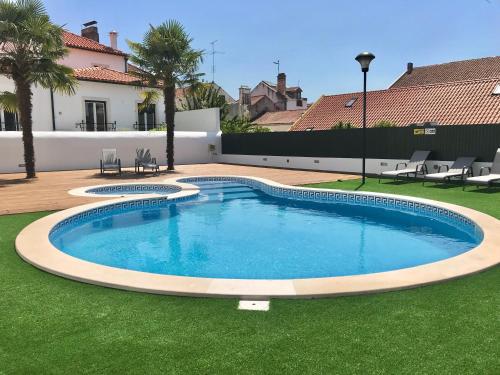 a swimming pool in the yard of a house at O Paço - exclusive accommodation in Tomar