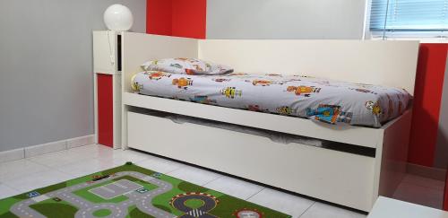 a childs bedroom with a bunk bed with a toy track at Au fil de la Loire in Vouvray
