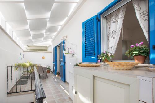 Postel nebo postele na pokoji v ubytování Le Gioie - Dimora Brezza Marina - Confortevole e grazioso appartamento a due passi dalla spiaggia