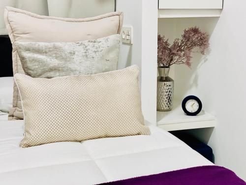 a bedroom with a bed with a pillow at Canaryislandshost l Brisa del Atlántico in Playa Honda