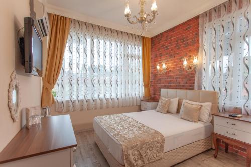 Кровать или кровати в номере Ozmen Hotel