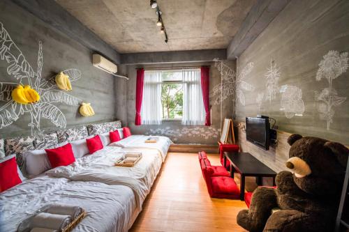 a living room with a large couch and a teddy bear at Farmland B&B in Guilin