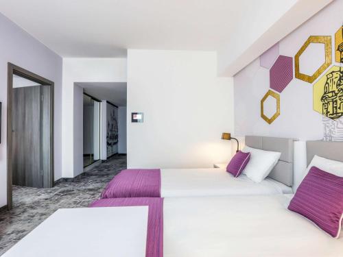 Postel nebo postele na pokoji v ubytování ibis Styles Nowy Sacz