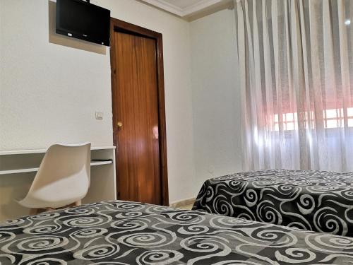 Cama o camas de una habitación en Hostal Madrid I