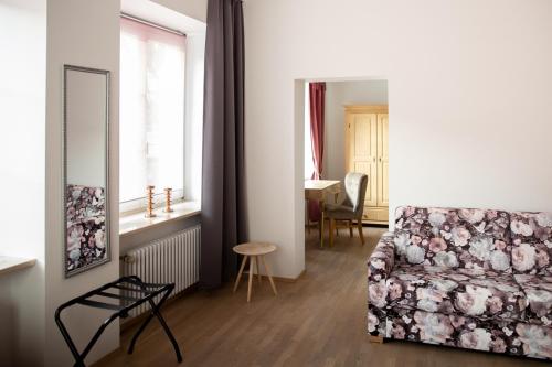 a living room with a couch and a table at Apartment 6 in Stockach