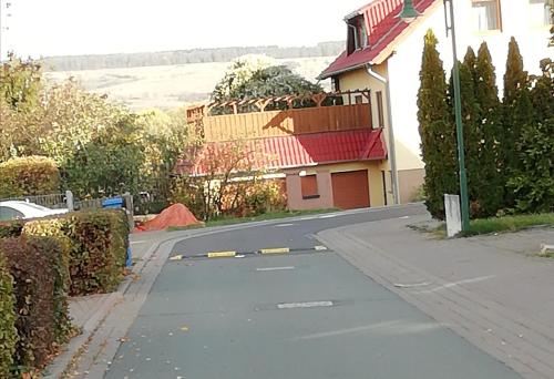 an empty street in front of a house at Ferienwohnung Weimar - Ulla in Weimar
