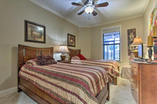 a bedroom with two beds and a ceiling fan at Ornate Resort Condo with Balcony, Pool, Water Views! in Pensacola