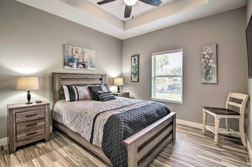 a bedroom with a bed and a table and a chair at Laguna Vista Resort-Style Home, Private Pool and Spa in Laguna Vista