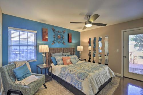 a bedroom with a bed and a chair at Beachy Palm Harbor Escape Swim Spa Pool and Gazebo in Palm Harbor