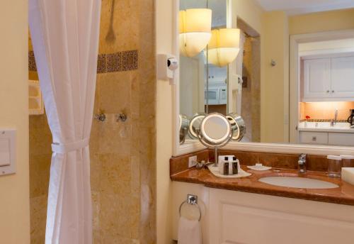 a bathroom with a sink and a shower with a mirror at Pueblo Bonito Rose Resort & Spa - All Inclusive in Cabo San Lucas