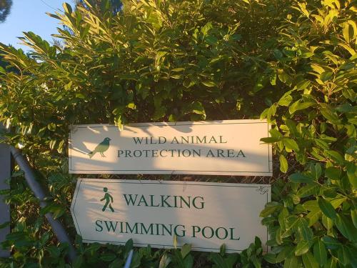 a sign for wild animal protection area and a tree at Hotel Panoramic Montepulciano in Montepulciano