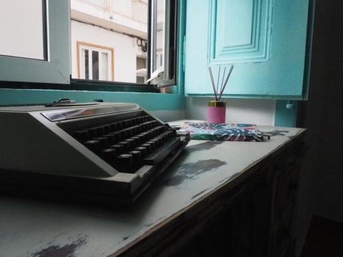 a kitchen counter with a keyboard on top of it at The Portuguese Element in Faro