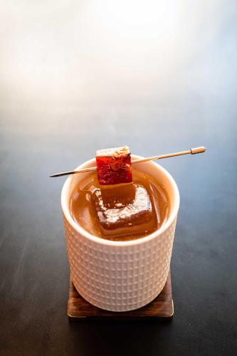 a white bowl with a piece of food in it at Hotel Bijou - Union Square in San Francisco