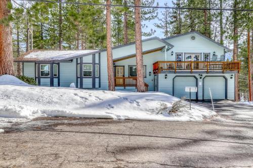 a house in the woods with snow on the ground at Skyline Serenity in South Lake Tahoe