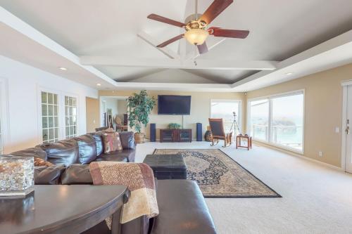 a living room with a couch and a ceiling fan at Whalerock Luxury Home in Trinidad