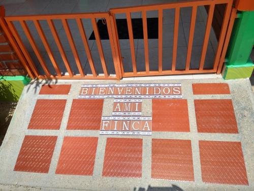a staircase with a red and white floor with a sign on it at Finca La Gaviota in Montenegro