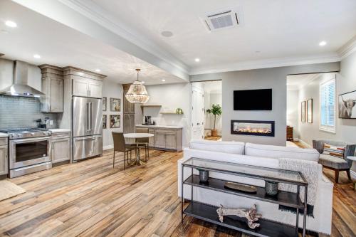 a living room with a white couch and a kitchen at Sonoma Bungalows in Sonoma
