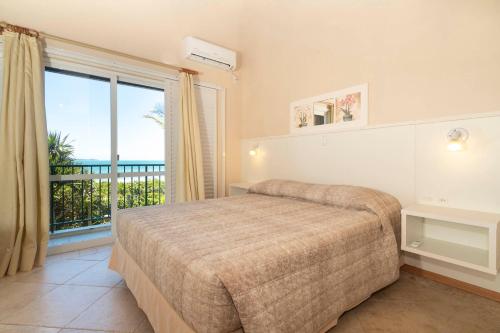 Ένα ή περισσότερα κρεβάτια σε δωμάτιο στο Pousada Morada do Guaruça