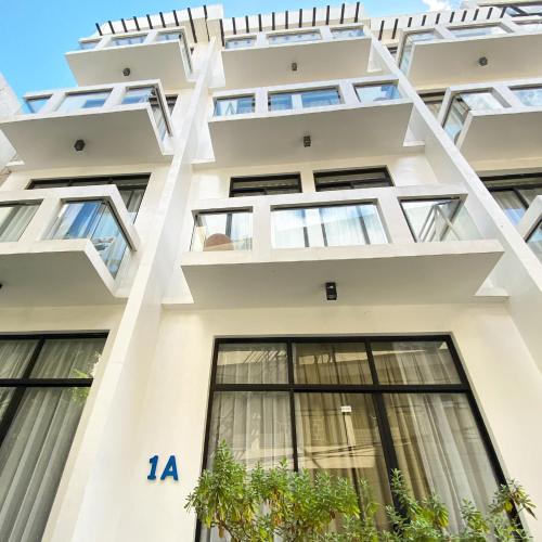a facade of a building with windows at Luxx Boutique Boracay in Boracay