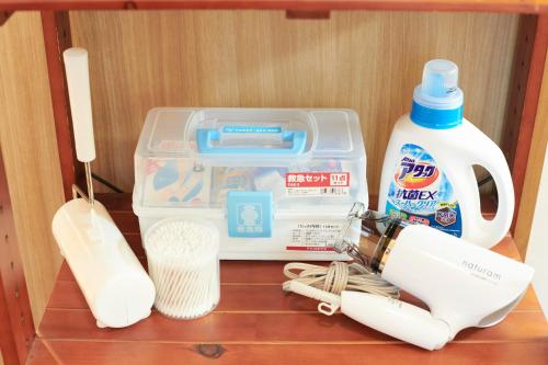 a plastic lunch box with a mixer and a bottle of milk at Awaji Portside Holiday Home CHOUTA - BBQ OK! - Self Check-In Only in Akashi