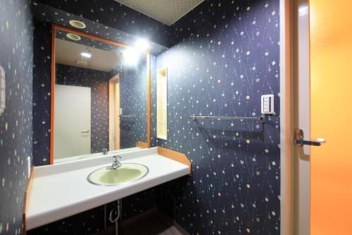 a bathroom with a sink and a mirror at Yutorelo-an ANNEX in Hakone