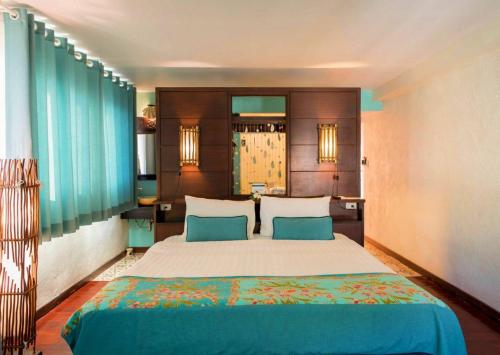 Кровать или кровати в номере Vacation Village Phra Nang Inn - SHA Extra Plus