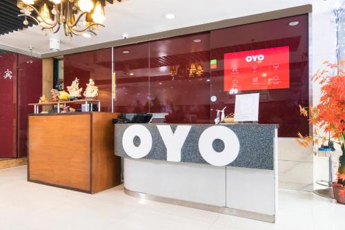 a restaurant with an oo sign on a counter at OYO 416 Lucky Hotel in Manila